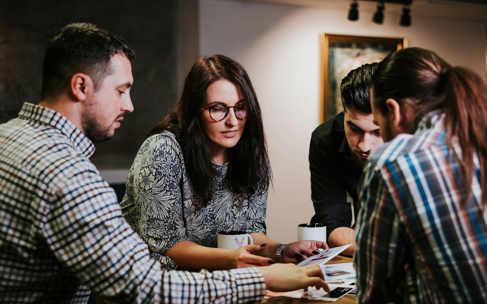 Zinga advisers reviewing paperwork with clients